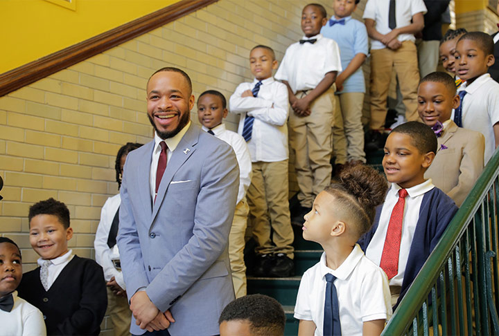 Teacher and students at Arthur Dixon Elementary School on “Tie Tuesday.” Image courtesy of the Children First Fund.