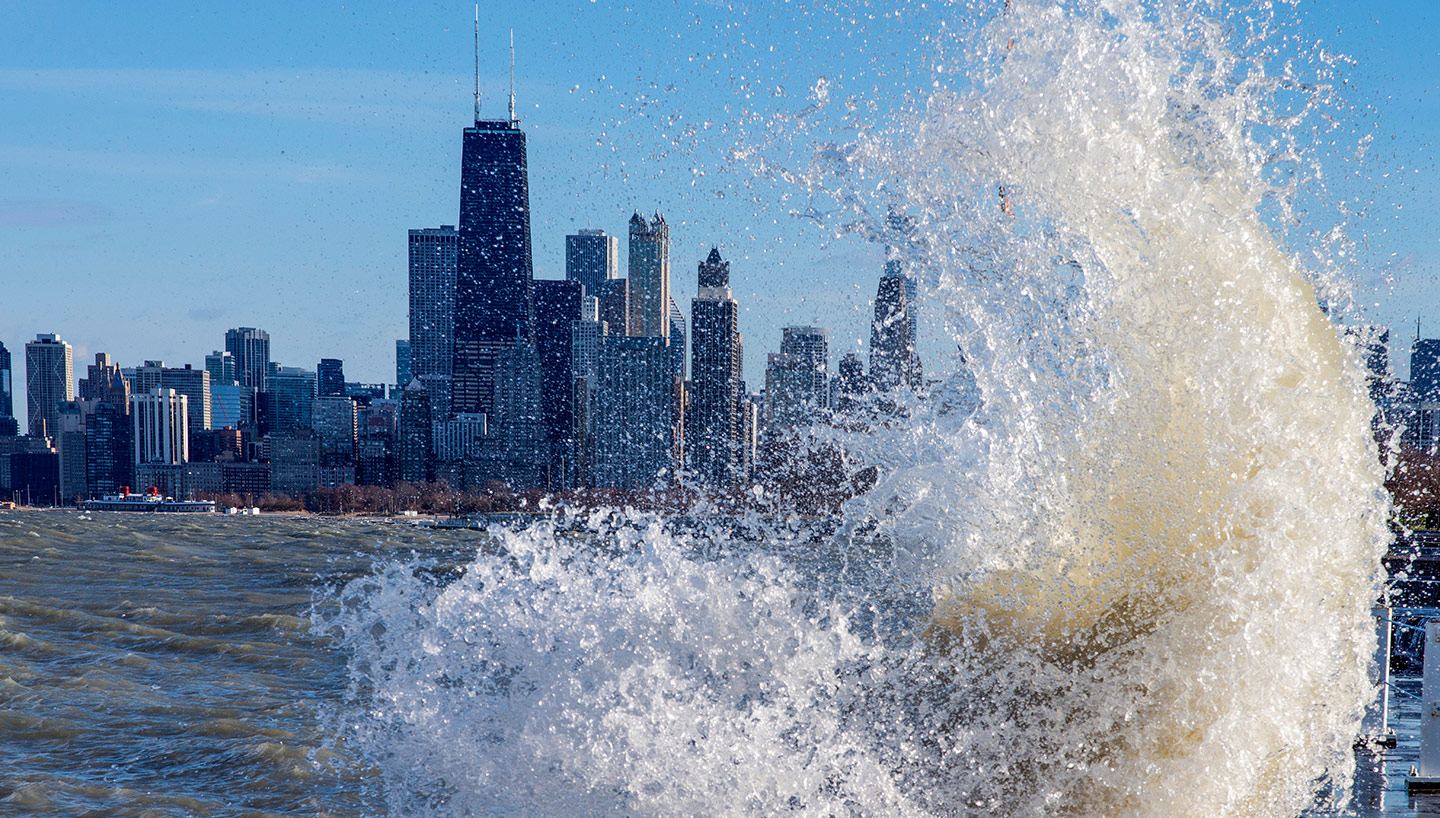 Wave splashing in the lake with Chicago skyline in the background